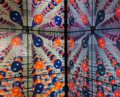Red and blue colored balls represent a 3-D model of a salt crystal.