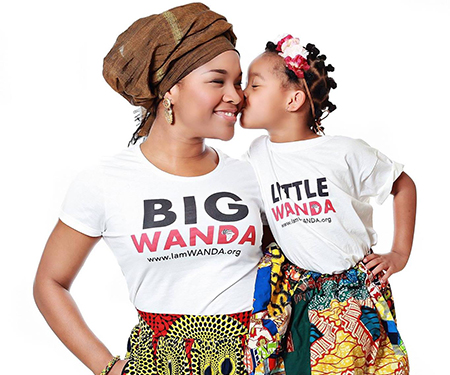 Tambra Stevenson wearing a white t-shirt that says “Big Wanda,” while holding a girl whose t-shirt says “Little Wanda.”