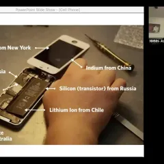 Video frame of a cellphone with labels indicating where certain raw materials in the phone originated.