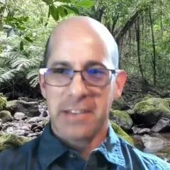 history of science worksheet A balding, light-skinned man with glasses in front of a forest background