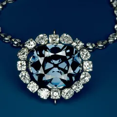 The Hope Diamond necklace, a large blue diamond encircled by smaller white diamonds.