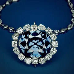 The Hope Diamond necklace, featuring a large blue diamond encircled by smaller white diamonds.