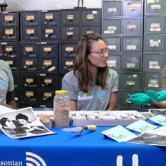 history of science worksheet Emmanuel Kyei-Baffour, Maggy Benson and Molly Kampf seated at a table in a room full of card files and several specimens pictures and tools on the table.