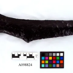 Black glass weapon shaped like a cutlass.