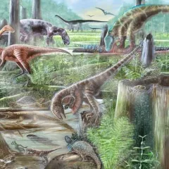 Lush green area with several dinosaurs foraging.