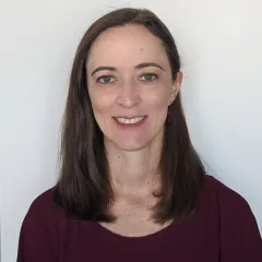 A woman smiling for a portrait photo