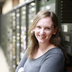 Holly Little in front of drawers in the paleobiology collections