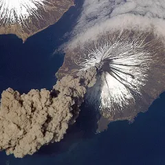 history of science worksheet Aerial view of an ash plume rising from Mount Cleveland volcano, which has snow on its upper slopes.