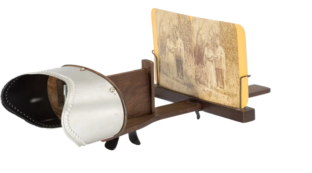 a wooden photograph view finder with an old photo in grasp