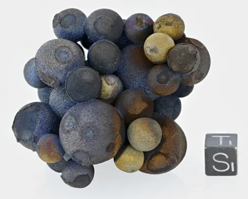 Cluster of chalcopyrite spheres resembling blueberries
