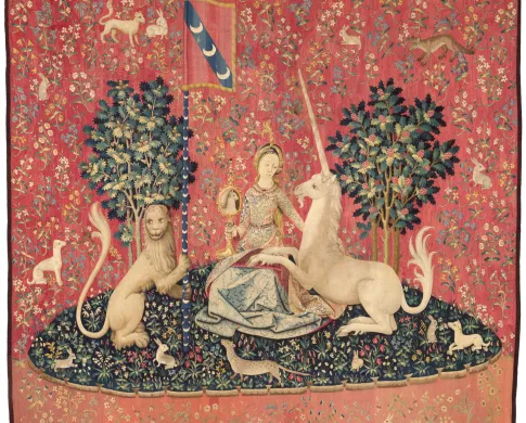 a mostly red tapestry showing the myth of narwhals as unicorns
