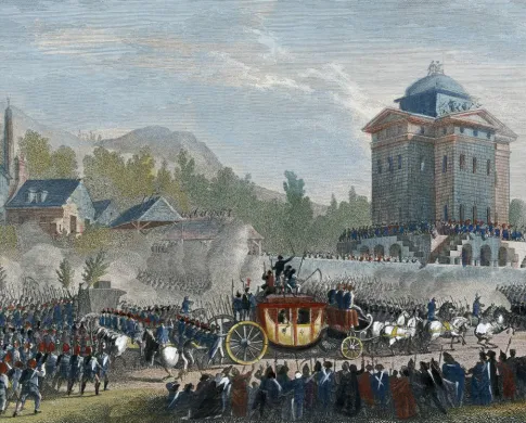 A horse-drawn carriage passes through a crowd in front of a tower