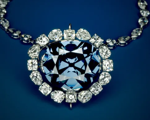Close-up of the Hope Diamond, a large blue diamond mounted in a necklace