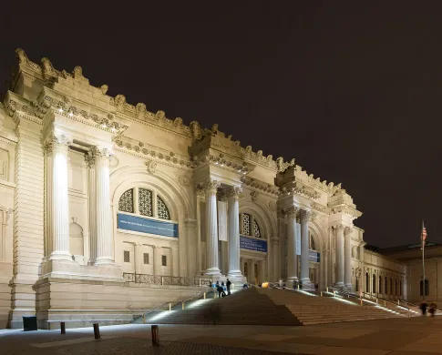 The front of the Metropolitan Museum of Art at night