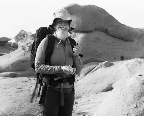 Lisa Bouche wearing a beard in the field 