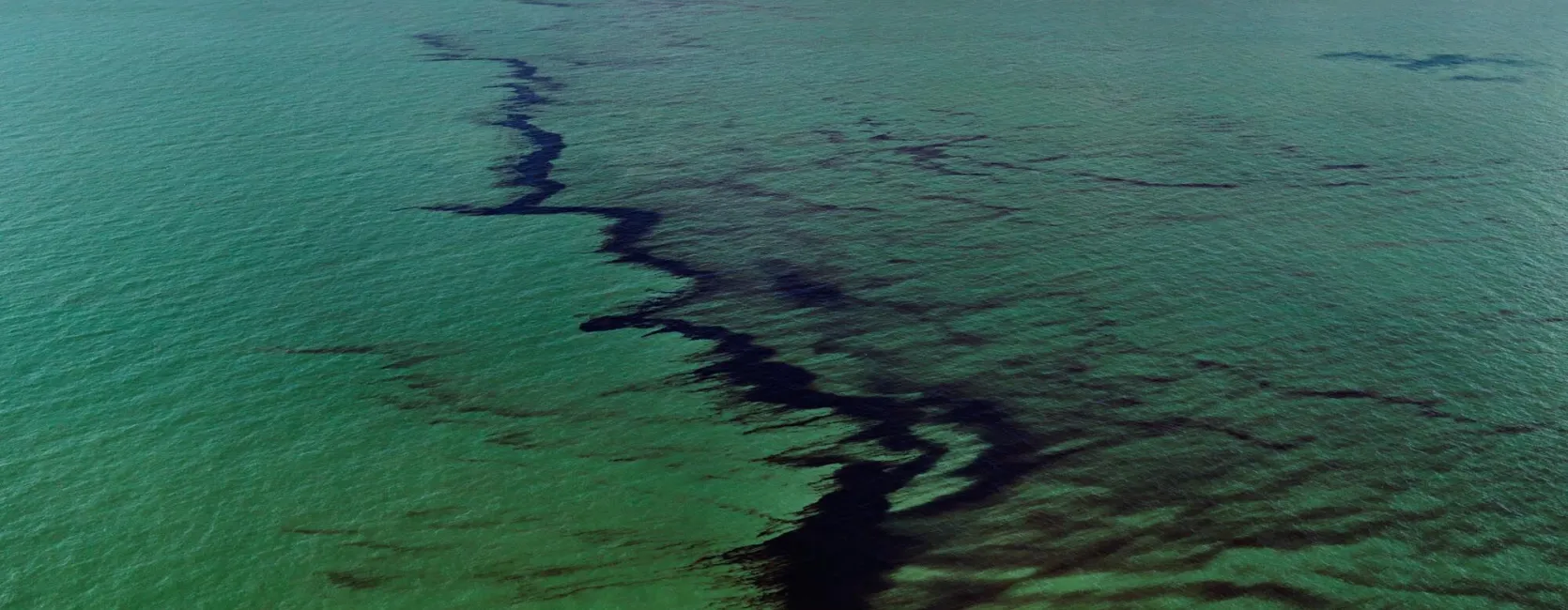 "Oil Spill #10, Oil Slick at Rip Tide, Gulf of Mexico, June 24, 2010" by Edward Burtynsky