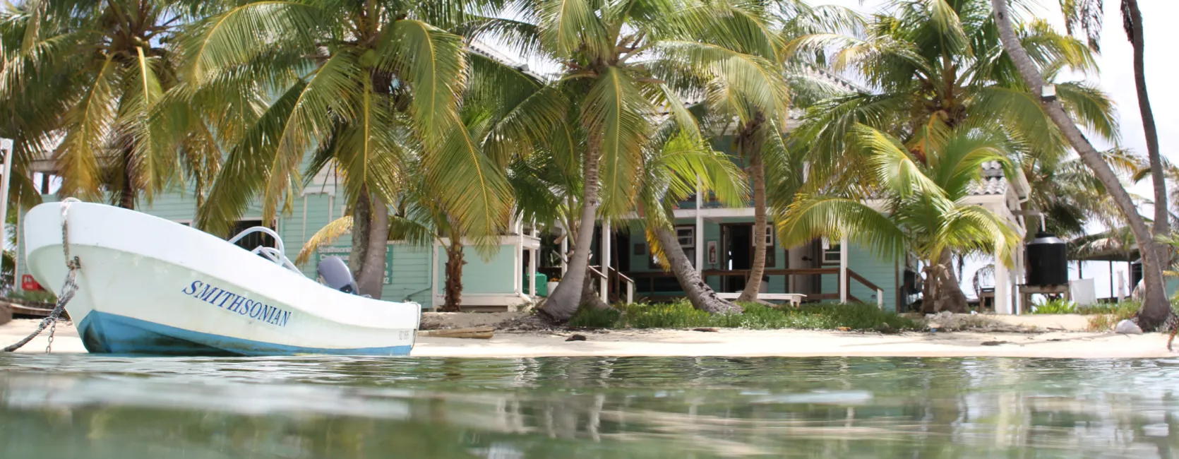 a boat off the shore of an island field station