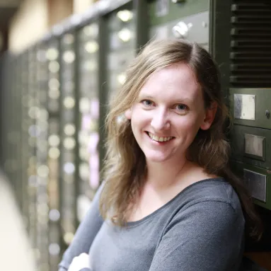 Holly Little in front of drawers in the paleobiology collections