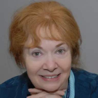 A woman smiling for a portrait photo