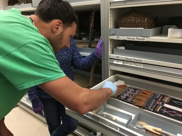 Person looking at Miami moccasins.