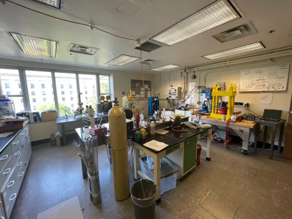 Lab featuring benches, gas cylinders, and other equipment