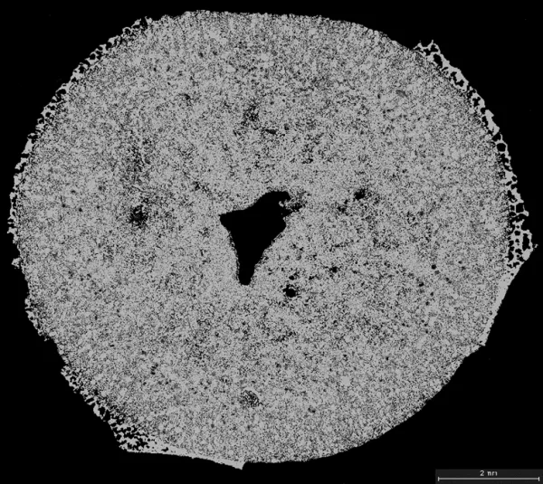 Mottled gray circle with a polygonal hole in the middle