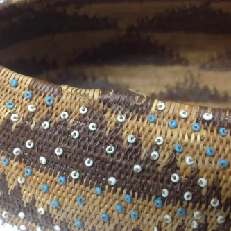 Close-up of beaded basket rim