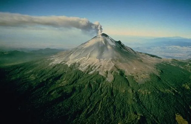 A plume of steam and ash rises above Popocatépetl