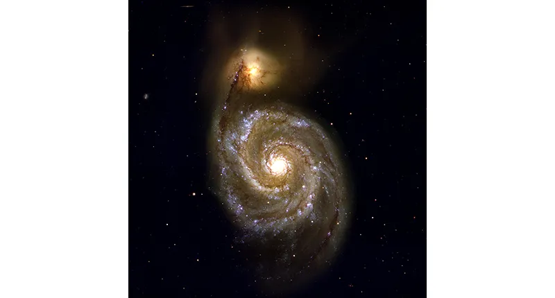 Spiral galaxy with a bright yellow center and bluish spiral arms