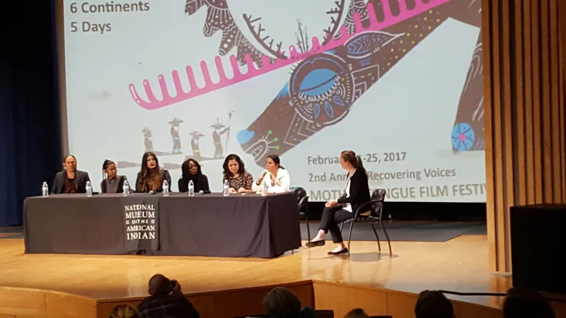 Panel of six people on a stage.