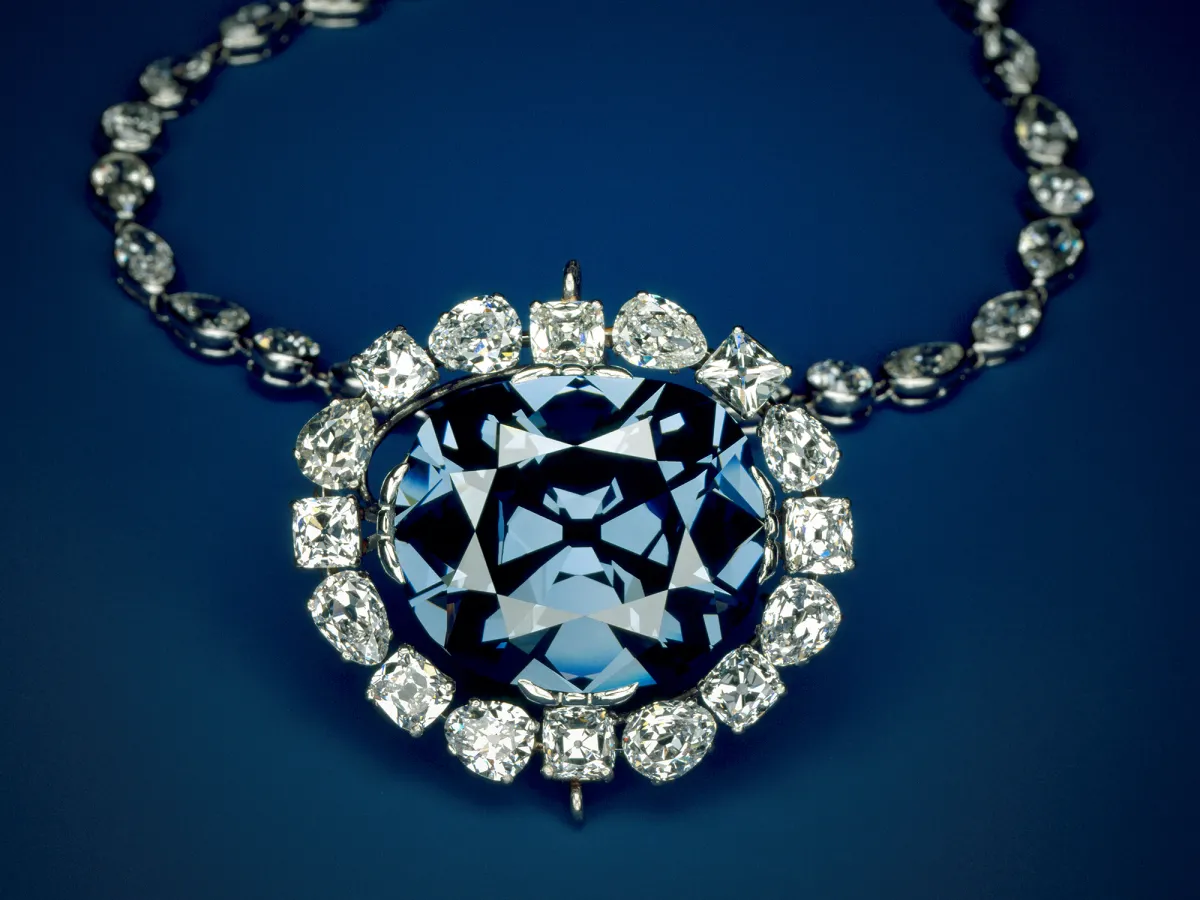 The Hope Diamond necklace, featuring a large blue diamond encircled by smaller white diamonds.