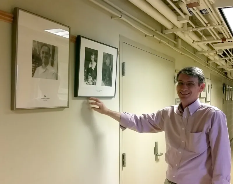 Steve Cairns with portrait of Dr. Ted Bayer
