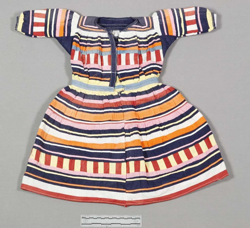 Patchwork dress for a baby, with colorful stripes