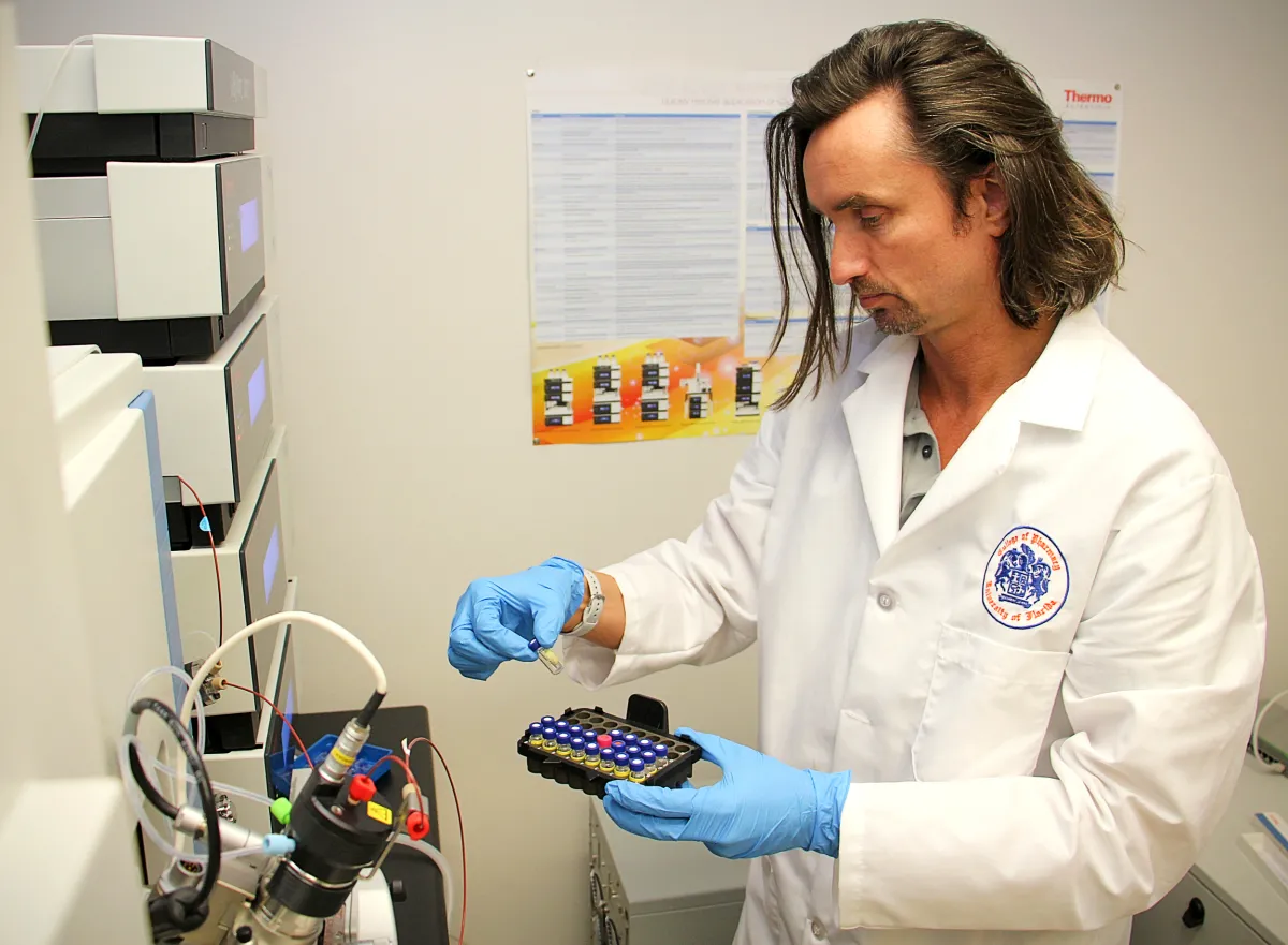 Dr. Luesch handling samples.