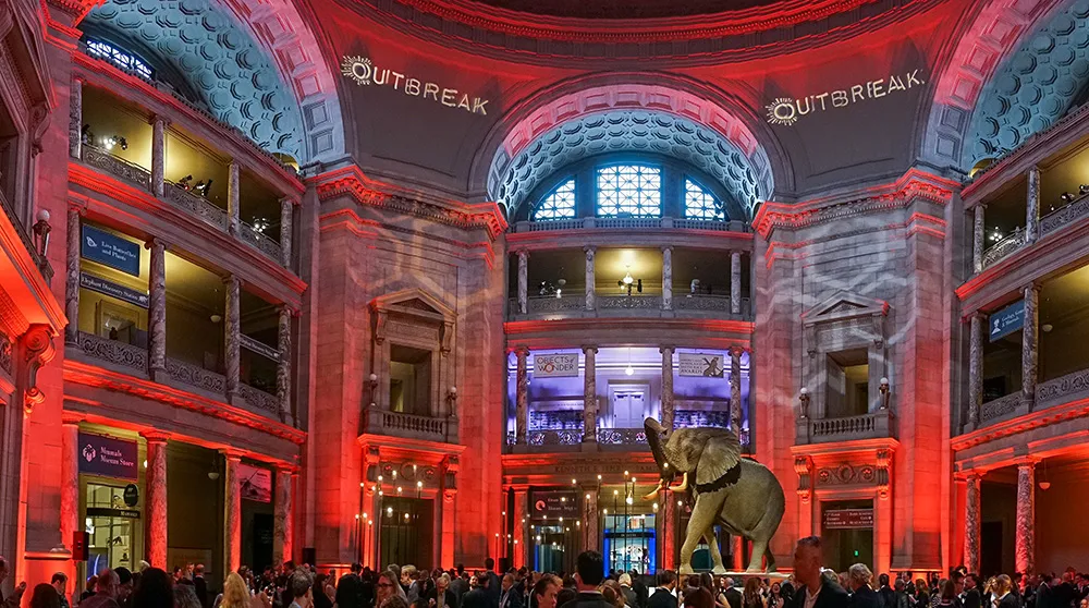 The rotunda transformed with red lighting for a private Outbreak reception