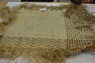 image of frayed unfinished edge of mat