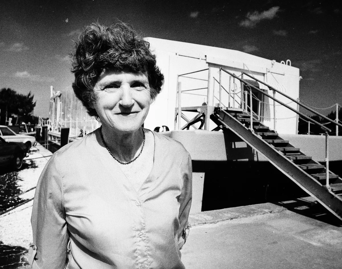 A woman standing in front of a building