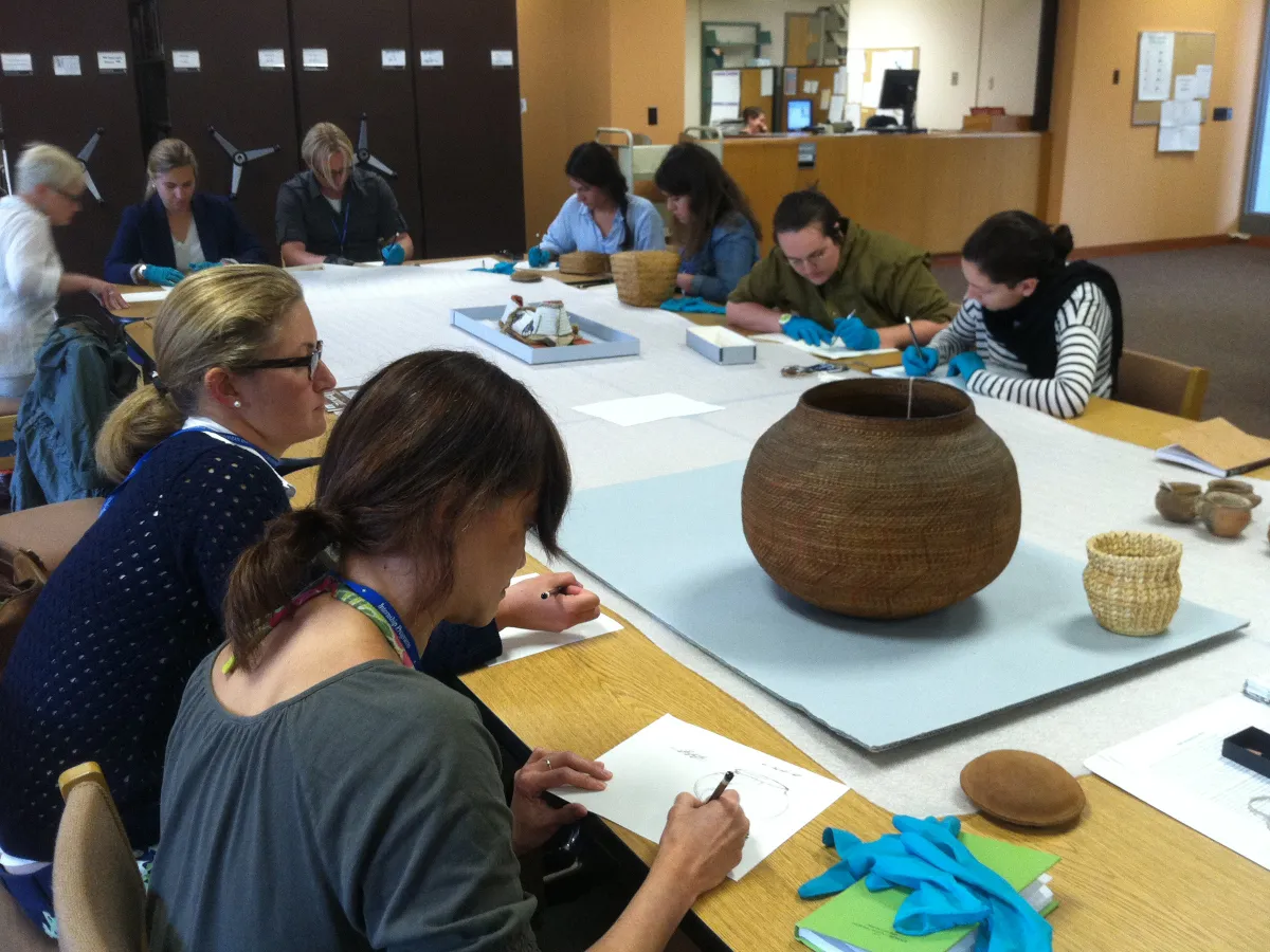 SIMA students, studying a basket