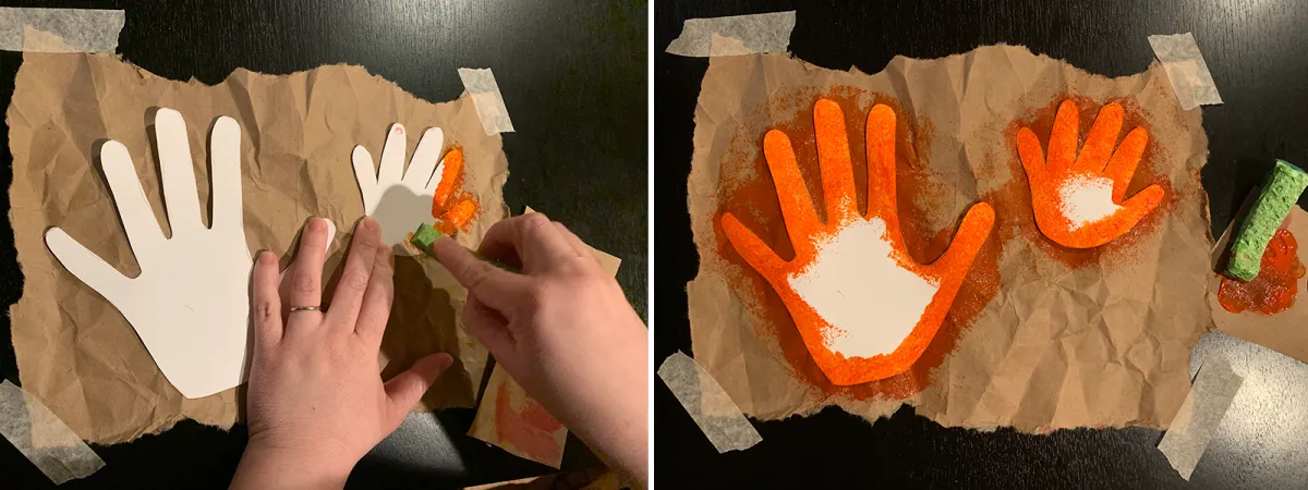 Two hands using a sponge to put red-orange paint around the edges of paper hand cutouts on brown paper. Adjacent image shows two hand cutouts with fully painted outlines.