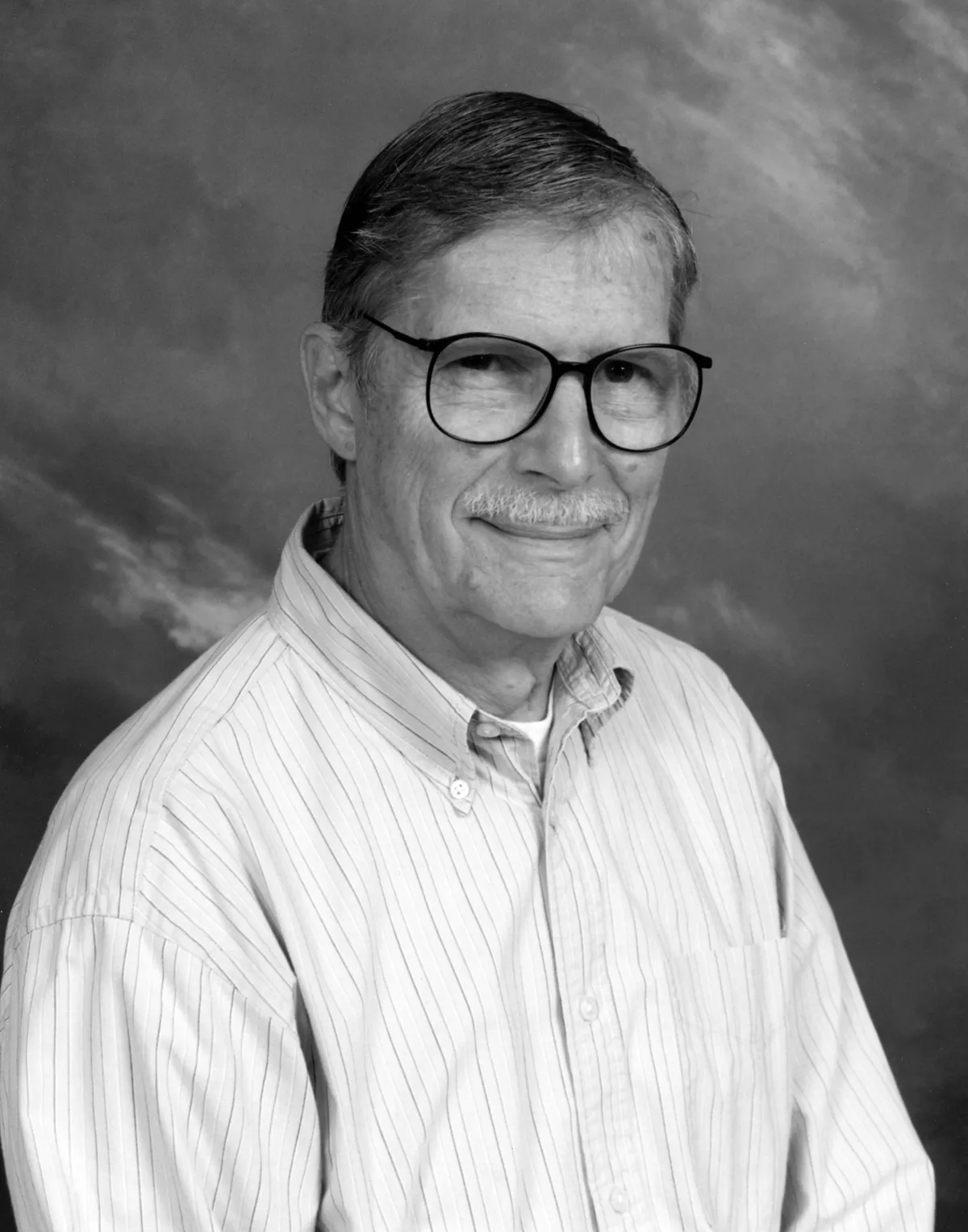 Black and white portrait of Richard Zusi. 